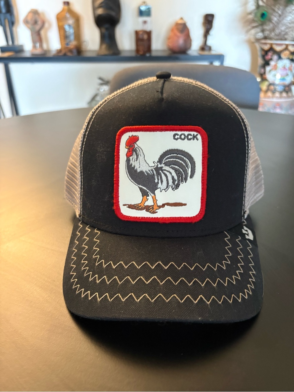 Goorin Bros Black and White Mesh Trucker Hat with Red Logo Stitching